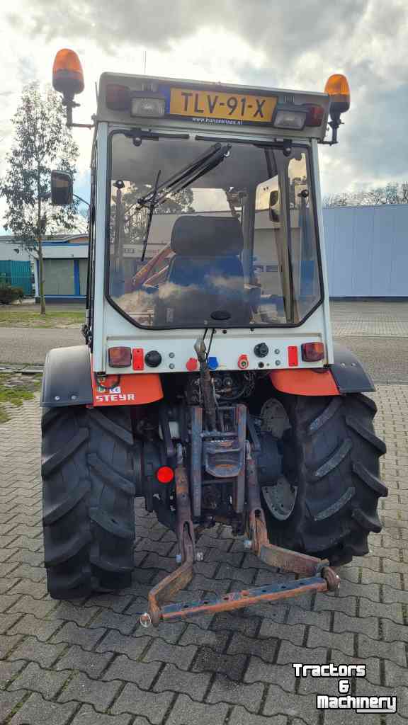 Schlepper / Traktoren Steyr 8075 AS 4WD smalspoor met maaiarm/maaibalk