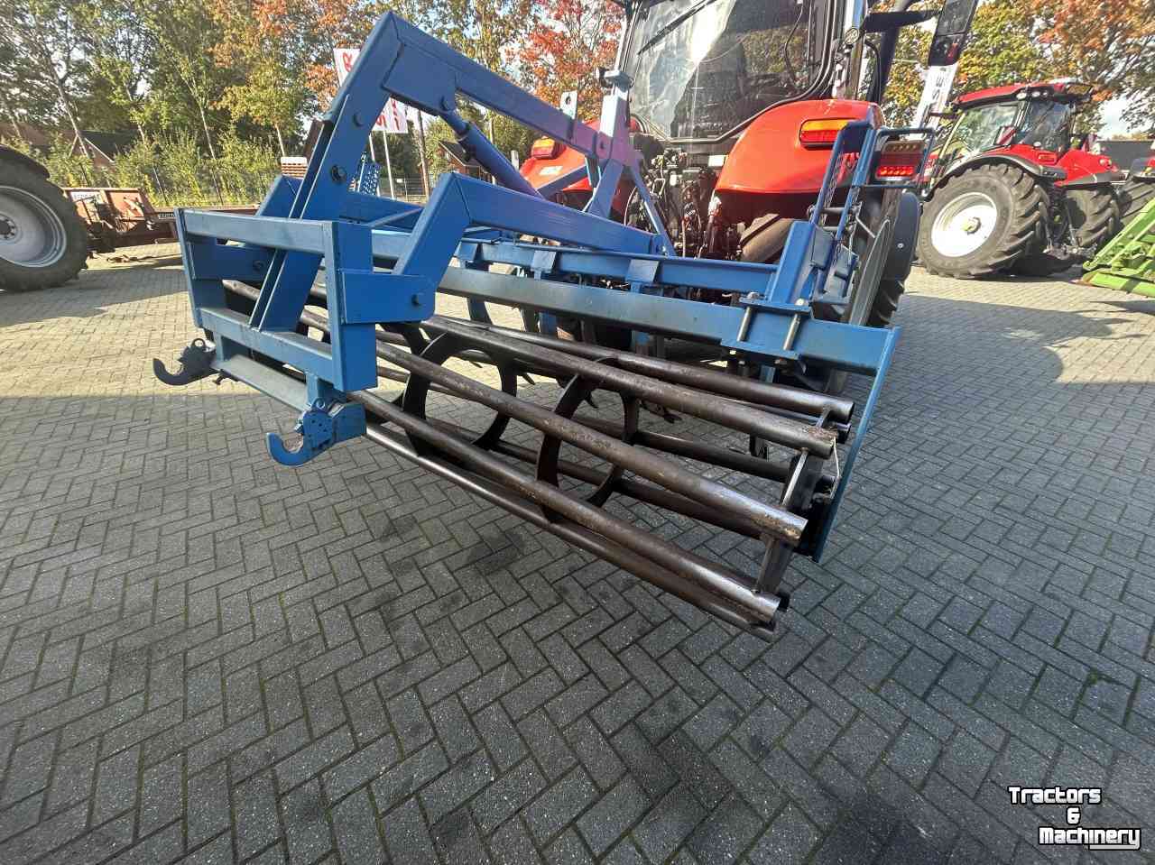 Grubber  Vaste tand cultivator met kooirol en hefinrichting