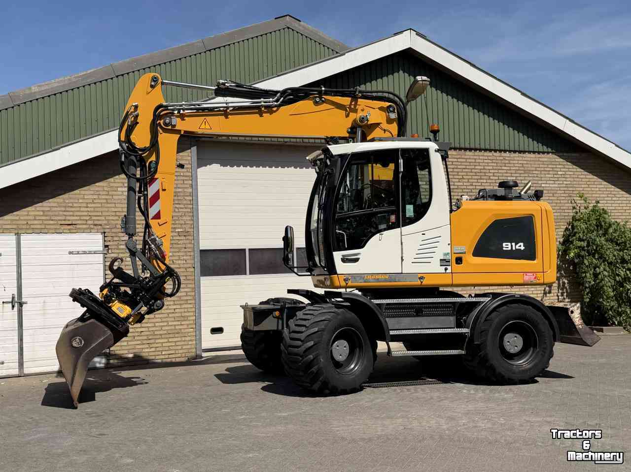 Mobilbagger Liebherr A914 met Draaikantelstuk