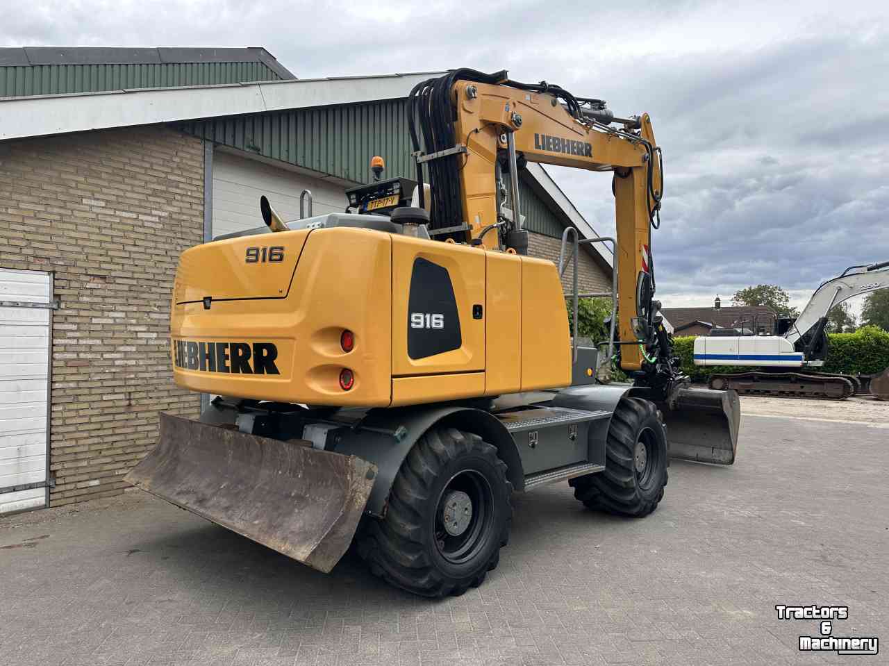 Mobilbagger Liebherr A916 met draaikantelstuk