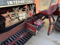 Fronthydraulik & Frontzapfwellen International universele fronthef, nu gemonteerd op een 956XL