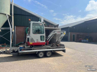 Raupenbagger Takeuchi TB016 met machinetrailer