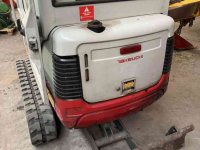 Raupenbagger Takeuchi TB016 met machinetrailer