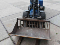 Radlader Giant D204SW minishovel wiellader puinriek en palletvork