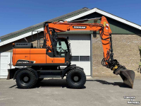 Mobilbagger Doosan DX140w-5 met draaikantelstuk